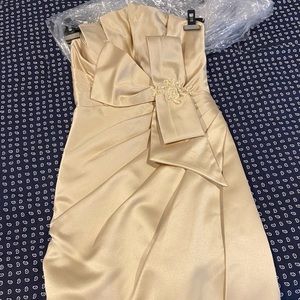 Elegant strapless satin cocktail dress iin champagne beige.